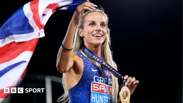 Georgia Hunter Bell celebrates victory in the 1500m at Birmingham 2026 by holding up her gold medal and union flag