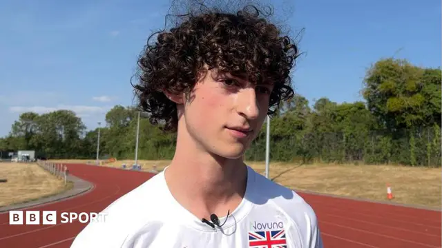 James Arminio standing on an athletics track