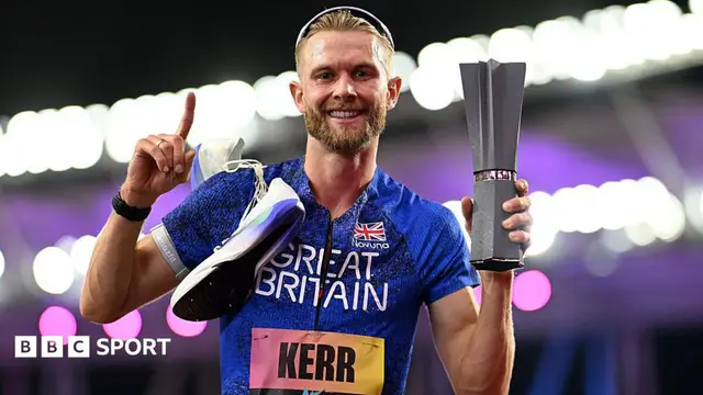 Josh Kerr celebrates while holding the 1500m trophy after winning the inaugural World Athletics Ultimate Champion event in Budapest, Hungary