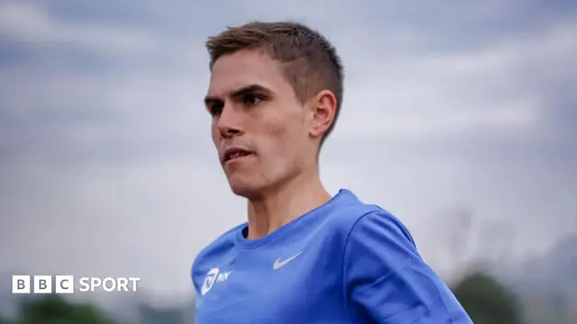 Jake Smith running in a blue T-shirt