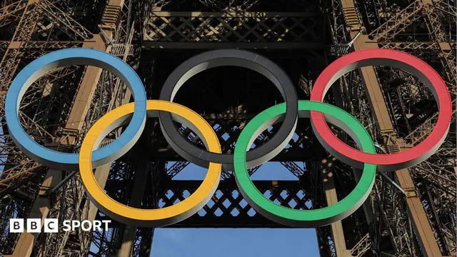 The Olympic rings mounted on the Eiffel Tower